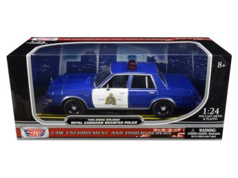 1986 Dodge Diplomat \Royal Canadian Mounted Police\" Metallic Blue and White 1/24 Diecast Model Car by Motormax"""