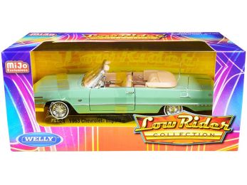 1963 Chevrolet Impala Convertible Light Green \Low Rider Collection\" 1/24 Diecast Model Car by Welly"""
