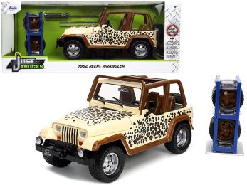 1992 Jeep Wrangler Tan and Brown with Graphics and Extra Wheels \Just Trucks\" Series 1/24 Diecast Model Car by Jada"""