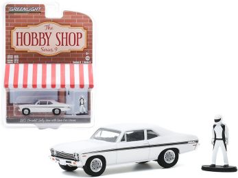 1972 Chevrolet Rally Nova White with Black Stripes with Race Car Driver Figurine \The Hobby Shop\" Series 9 1/64 Diecast Model Car by Greenlight"""