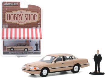 1992 Ford Crown Victoria LX Gold Metallic with Man in Suit Figurine \The Hobby Shop\" Series 9 1/64 Diecast Model Car by Greenlight"""