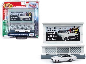 1967 Buick GS 400 White with \Buick\" City Billboard \""Johnny Lightning 50th Anniversary\"" 1/64 Diecast Model Car by Johnny Lightning"""